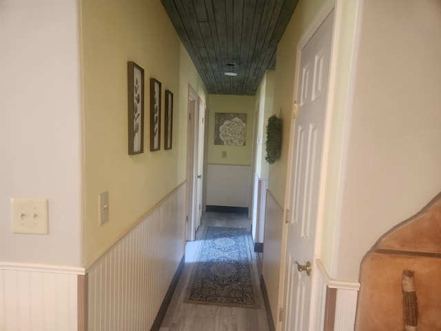 20263 Sugar Pine St, Burney, CA 96013 - corridor featuring a wainscoted wall and wood finished floors