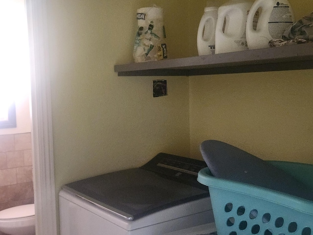 20263 Sugar Pine St, Burney, CA 96013 - washroom with washer / dryer and tile walls