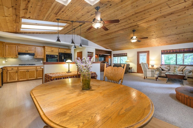 36088 Deer Flat Rd, Shingletown, CA 96088 - dining area featuring a skylight, ceiling fan, vaulted ceiling, wood ceiling, and light wood-style flooring