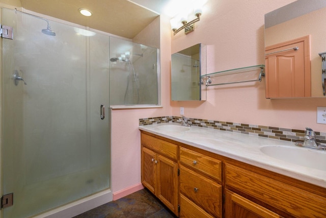 36088 Deer Flat Rd, Shingletown, CA 96088 - bathroom featuring a stall shower, double vanity, and tasteful backsplash