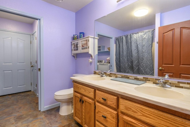 36088 Deer Flat Rd, Shingletown, CA 96088 - bathroom with separate washer and dryer, double vanity, and a shower with curtain
