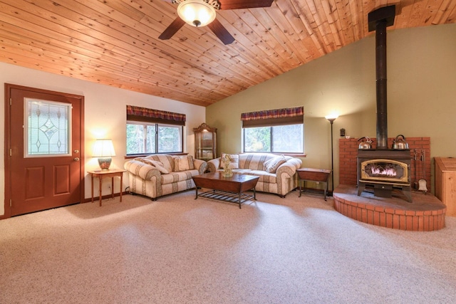36088 Deer Flat Rd, Shingletown, CA 96088 - living room with a wood stove, lofted ceiling, carpet floors, a ceiling fan, and wood ceiling