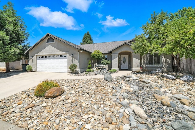 2072 Button Pl, Redding, CA 96002 - ranch-style home with an attached garage, stucco siding, and concrete driveway