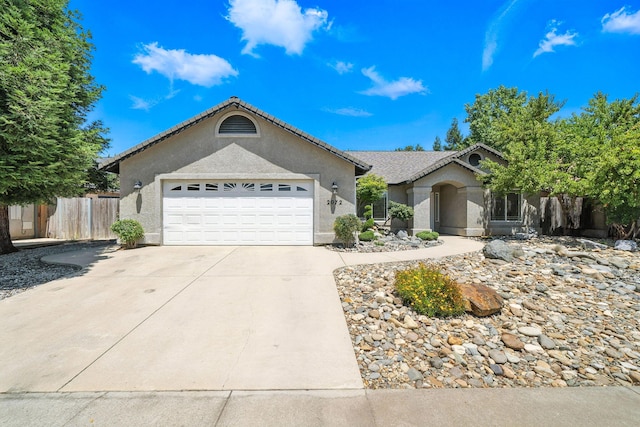 2072 Button Pl, Redding, CA 96002 - ranch-style house with concrete driveway, a garage, and stucco siding