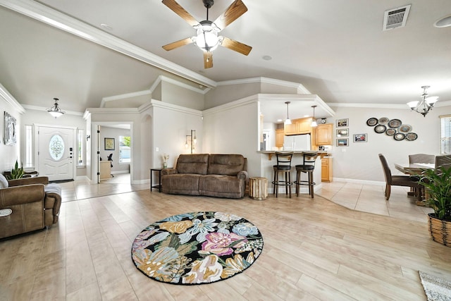 2072 Button Pl, Redding, CA 96002 - living area featuring vaulted ceiling, ceiling fan, crown molding, a chandelier, and light wood-type flooring
