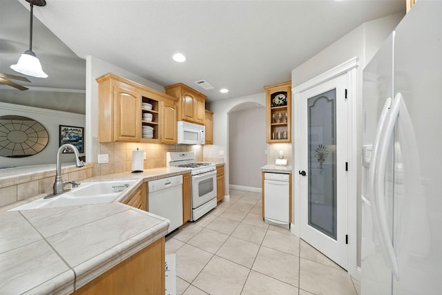 2072 Button Pl, Redding, CA 96002 - kitchen featuring white appliances, open shelves, backsplash, recessed lighting, and arched walkways