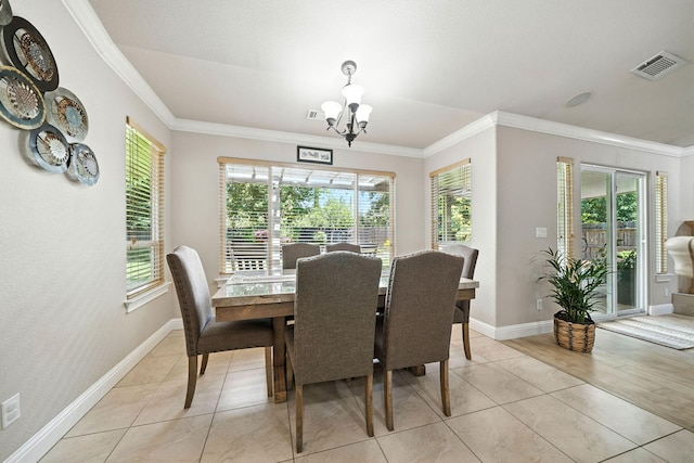 2072 Button Pl, Redding, CA 96002 - dining area with crown molding, a chandelier, and light tile patterned floors