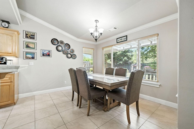 2072 Button Pl, Redding, CA 96002 - dining room with a chandelier, ornamental molding, light tile patterned floors, and lofted ceiling