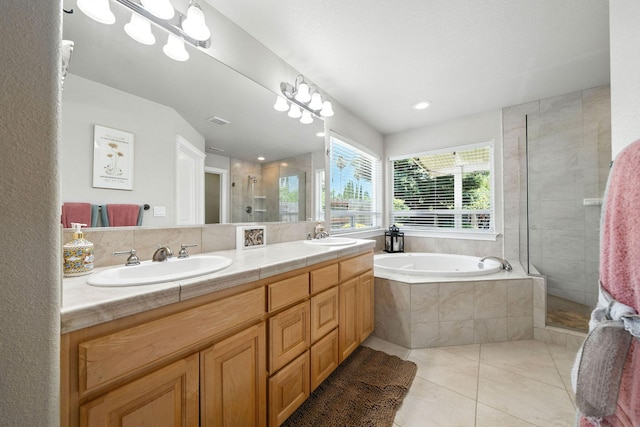 2072 Button Pl, Redding, CA 96002 - bathroom featuring a stall shower, double vanity, a bath, tile patterned floors, and recessed lighting