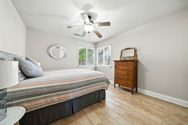 2072 Button Pl, Redding, CA 96002 - bedroom featuring light wood-type flooring and ceiling fan