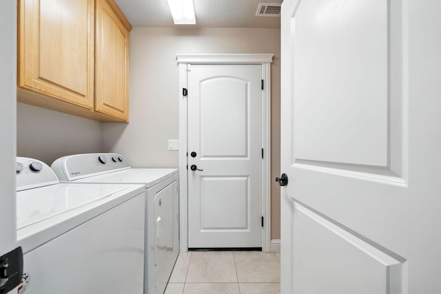 2072 Button Pl, Redding, CA 96002 - laundry room with washing machine and clothes dryer, cabinet space, and light tile patterned floors