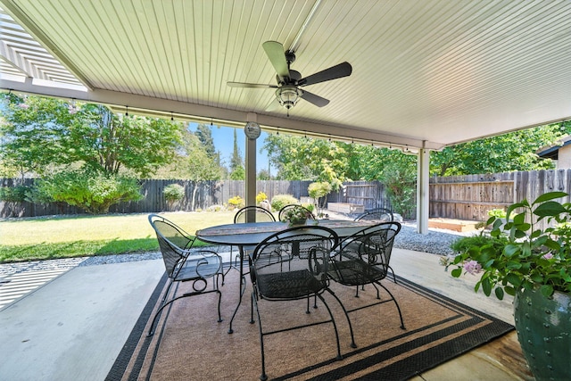 2072 Button Pl, Redding, CA 96002 - fenced backyard featuring a patio, outdoor dining area, and ceiling fan