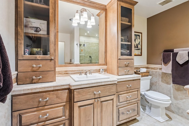 14480 Warren Ave, Red Bluff, CA 96080 - bathroom with tile walls, vanity, tile patterned flooring, a shower stall, and wainscoting