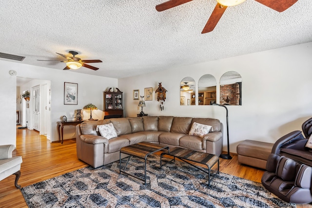 14480 Warren Ave, Red Bluff, CA 96080 - living room with a ceiling fan, wood finished floors, and a textured ceiling