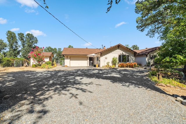 14480 Warren Ave, Red Bluff, CA 96080 - view of front of home with gravel driveway and a garage