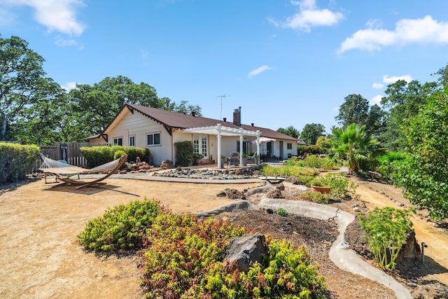 14480 Warren Ave, Red Bluff, CA 96080 - rear view of house featuring a pergola, a patio, and a chimney