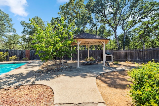 14480 Warren Ave, Red Bluff, CA 96080 - fenced backyard featuring a gazebo and a patio area