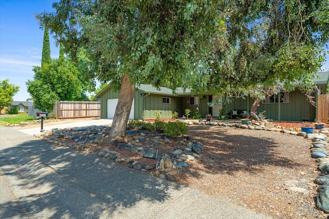 4215 Oro St, Redding, CA 96002 - view of front of home featuring board and batten siding, concrete driveway, and a garage