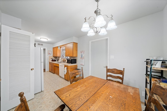 4215 Oro St, Redding, CA 96002 - dining space featuring a chandelier and light floors