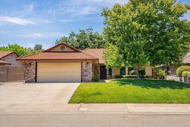3628 Somerset Ave, Redding, CA 96002 - view of front facade with a tiled roof, a garage, concrete driveway, and brick siding