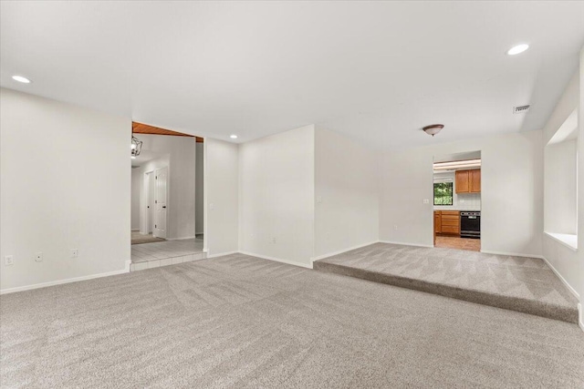 3628 Somerset Ave, Redding, CA 96002 - unfurnished living room with light carpet and recessed lighting