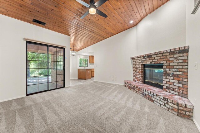 3628 Somerset Ave, Redding, CA 96002 - unfurnished living room with wooden ceiling, carpet flooring, a ceiling fan, a brick fireplace, and lofted ceiling