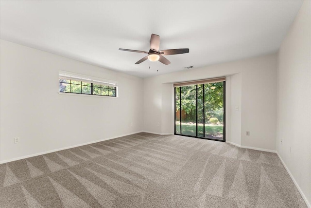 3628 Somerset Ave, Redding, CA 96002 - carpeted empty room featuring plenty of natural light and ceiling fan