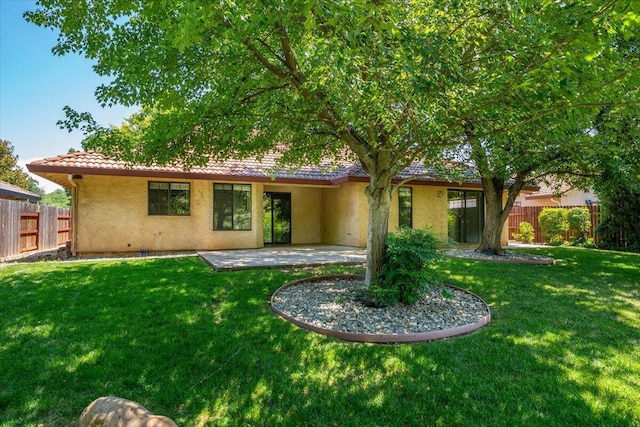 3628 Somerset Ave, Redding, CA 96002 - back of property featuring stucco siding, a patio area, and a tiled roof