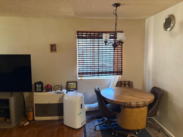 20194 Sugar Pine St, Burney, CA 96013 - dining room with a textured ceiling, a chandelier, and wood finished floors
