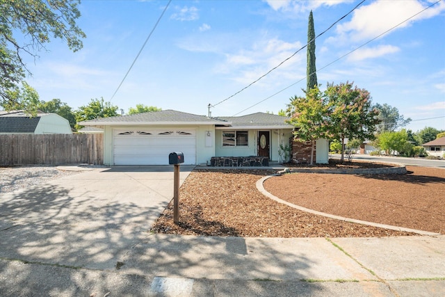 3255 Winding Way, Redding, CA 96003 - ranch-style house with concrete driveway, a garage, and covered porch