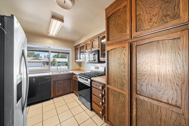3255 Winding Way, Redding, CA 96003 - kitchen with black appliances, light tile patterned floors, light countertops, glass insert cabinets, and brown cabinets