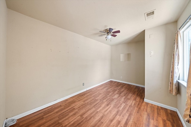 3255 Winding Way, Redding, CA 96003 - unfurnished room with wood finished floors and a ceiling fan