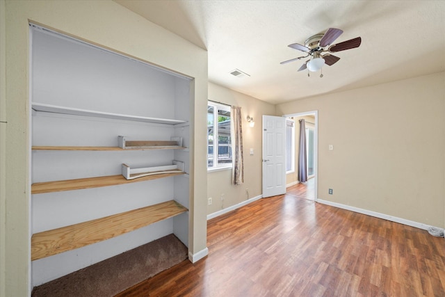 3255 Winding Way, Redding, CA 96003 - empty room with wood finished floors and a ceiling fan