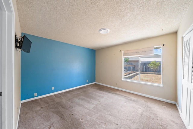3255 Winding Way, Redding, CA 96003 - unfurnished room featuring carpet floors and a textured ceiling