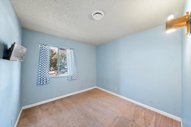 3255 Winding Way, Redding, CA 96003 - spare room featuring carpet flooring and a textured ceiling