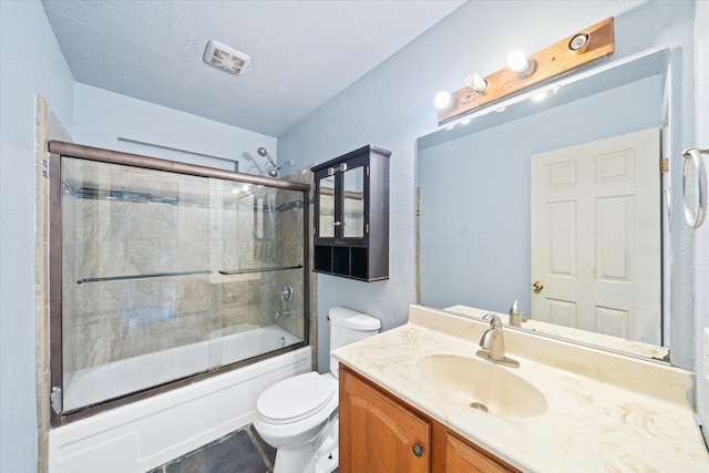 3255 Winding Way, Redding, CA 96003 - bathroom with vanity, bath / shower combo with glass door, and a textured wall