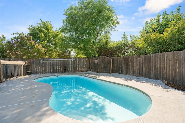 3255 Winding Way, Redding, CA 96003 - view of swimming pool with a fenced backyard and a patio