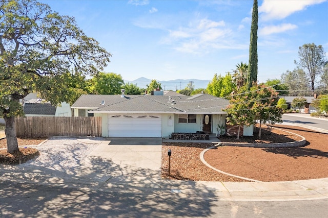 3255 Winding Way, Redding, CA 96003 - single story home with driveway, an attached garage, and a mountain view