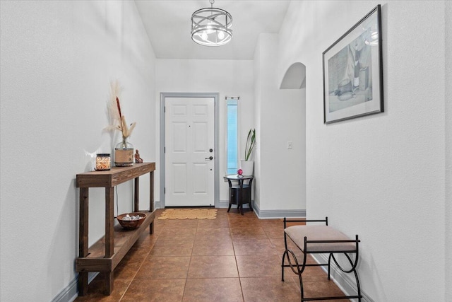 2236 Lonigan Ct, Redding, CA 96001 - foyer with dark tile patterned floors and arched walkways