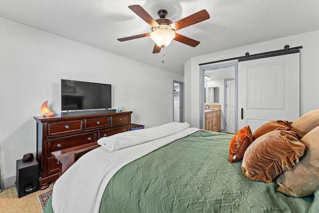 2236 Lonigan Ct, Redding, CA 96001 - carpeted bedroom with ensuite bathroom, ceiling fan, and a barn door