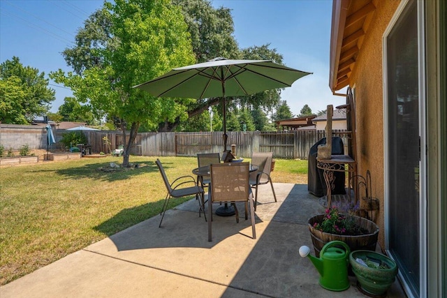 2236 Lonigan Ct, Redding, CA 96001 - fenced backyard featuring outdoor dining space, a patio area, and a grill