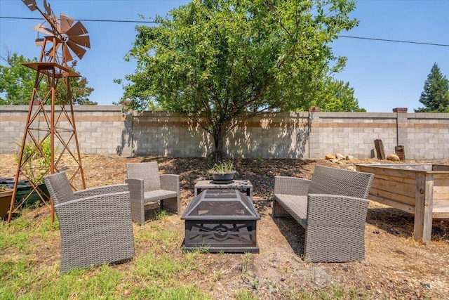 2236 Lonigan Ct, Redding, CA 96001 - fenced yard featuring an outdoor fire pit