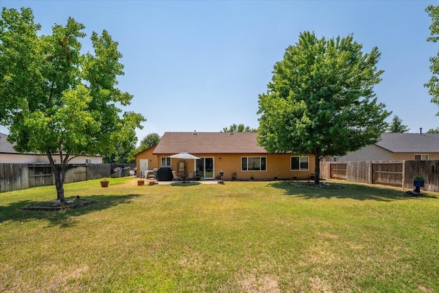 2236 Lonigan Ct, Redding, CA 96001 - back of property featuring a fenced backyard and a patio