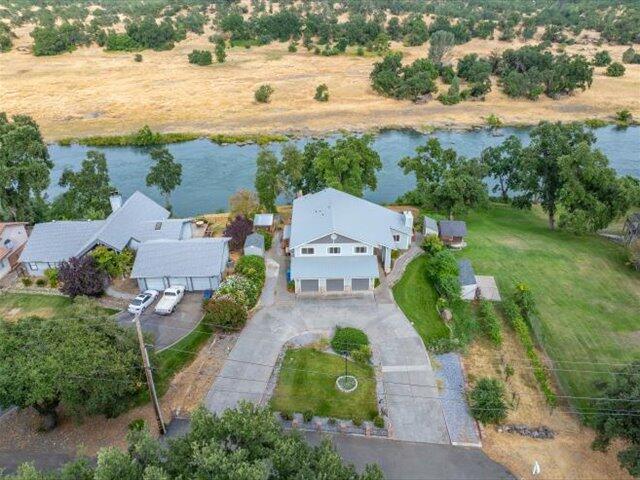 15540 China Rapids Dr, Red Bluff, CA 96080 - aerial view of property and surrounding area featuring a nearby body of water