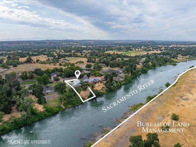 15540 China Rapids Dr, Red Bluff, CA 96080 - aerial overview of property's location featuring a nearby body of water and property parcel outlined
