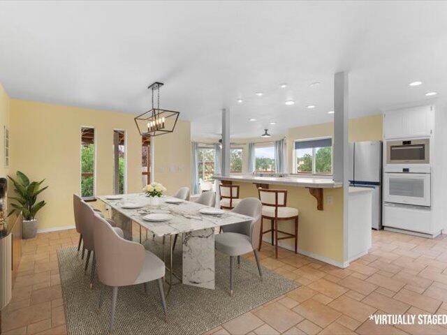 15540 China Rapids Dr, Red Bluff, CA 96080 - dining room with a chandelier and recessed lighting