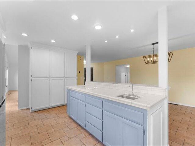 15540 China Rapids Dr, Red Bluff, CA 96080 - kitchen with white cabinets, recessed lighting, and tile countertops