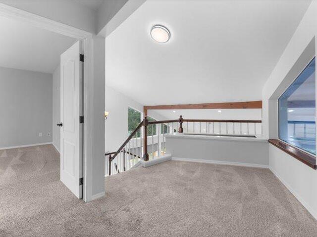 15540 China Rapids Dr, Red Bluff, CA 96080 - corridor featuring carpet floors and an upstairs landing