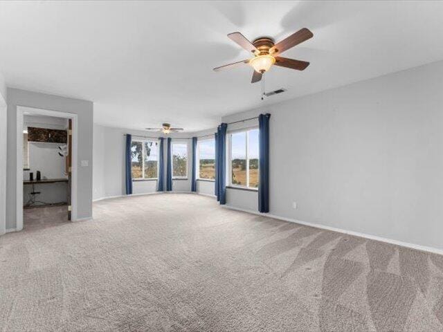 15540 China Rapids Dr, Red Bluff, CA 96080 - unfurnished room featuring a ceiling fan and carpet