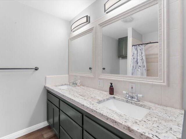 15540 China Rapids Dr, Red Bluff, CA 96080 - bathroom featuring double vanity and wood finished floors